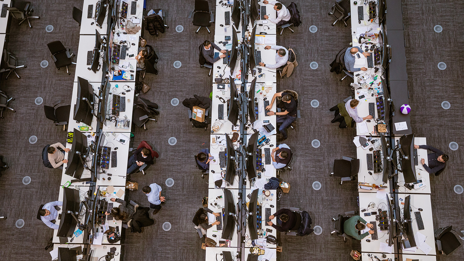 Photo of a trading floor.