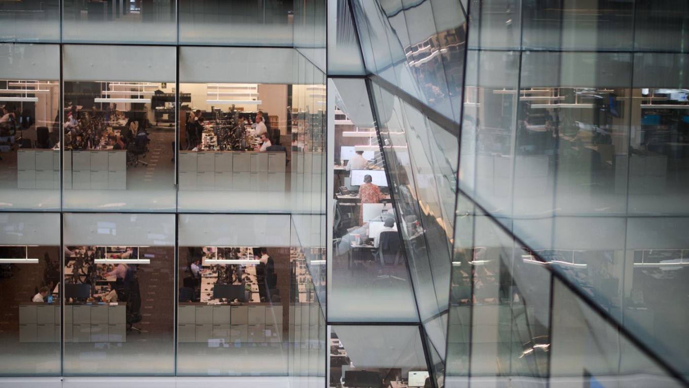 Photo of workers in an office building.