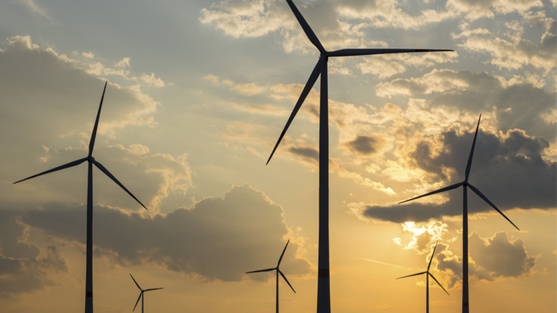 Wind turbines at sunset