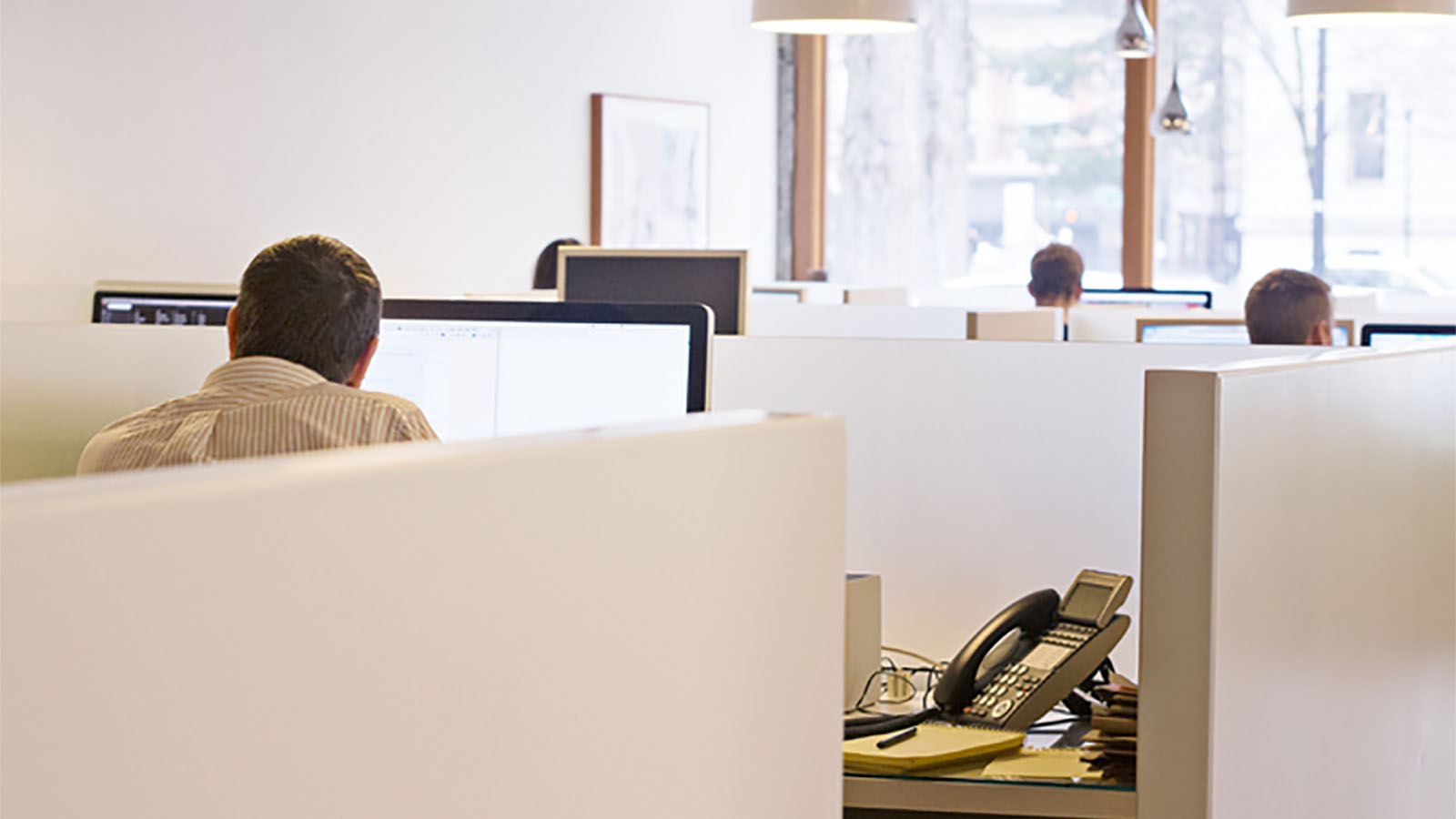 Photo of workers in an office.