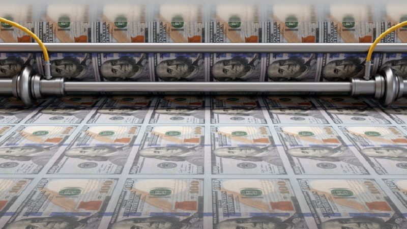 Photo of $100 bills on a currency printing press