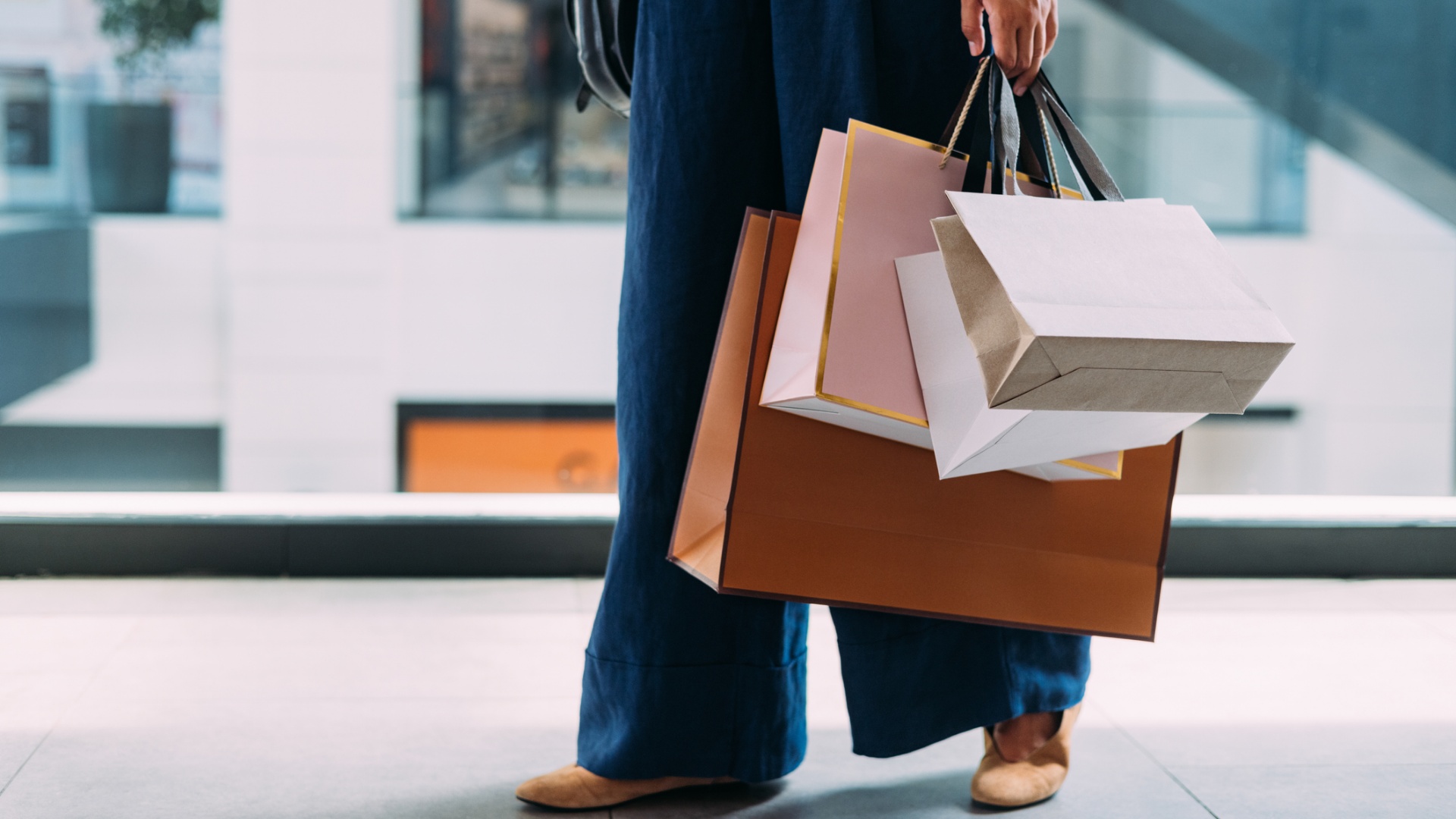 Woman in a shopping area with shopping bags