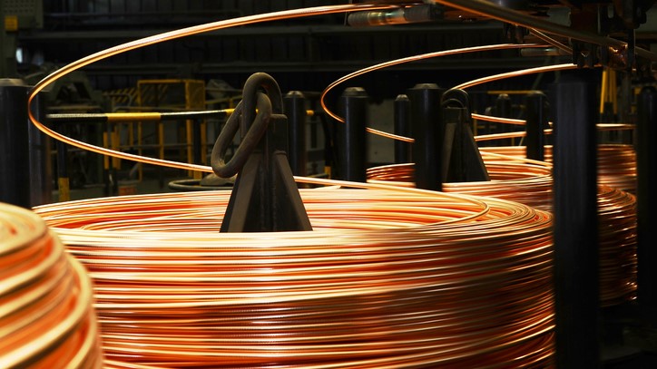 Photo showing reels of copper wire in a manufacturing setting