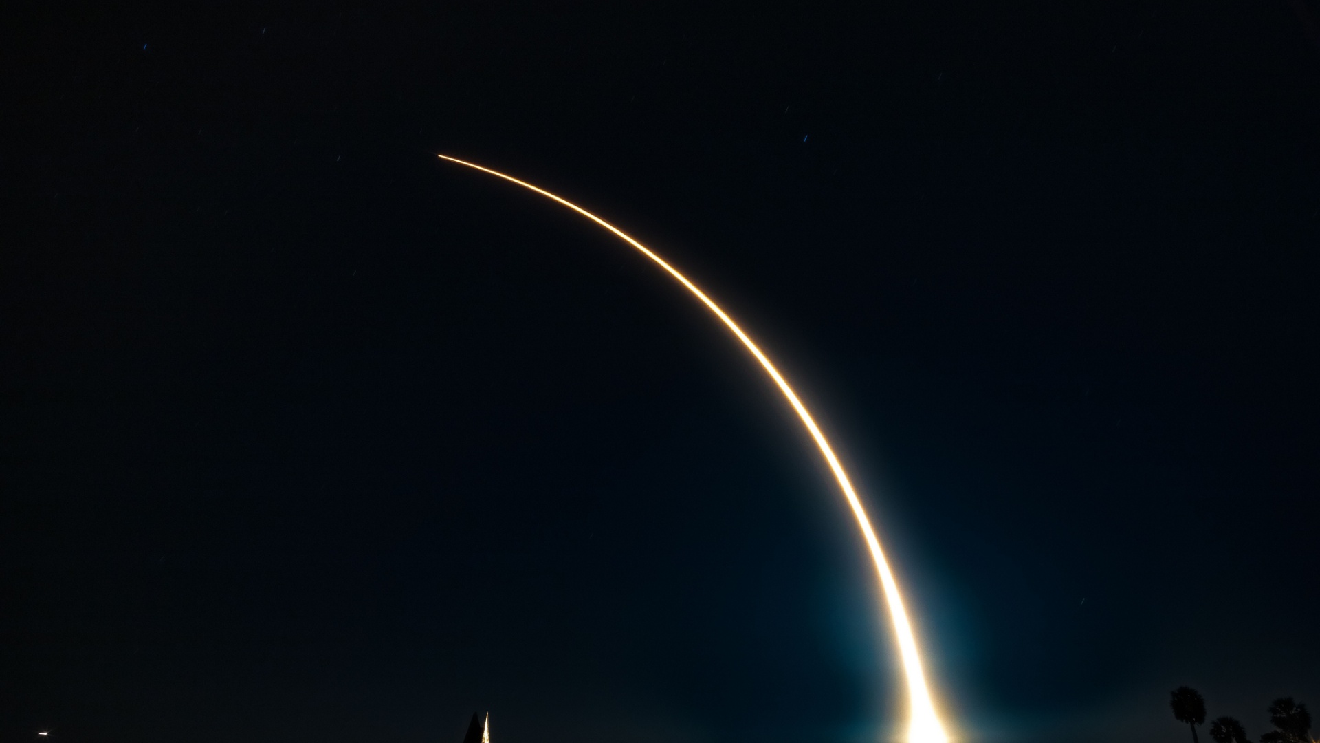 Photo of a nighttime rocket launch.