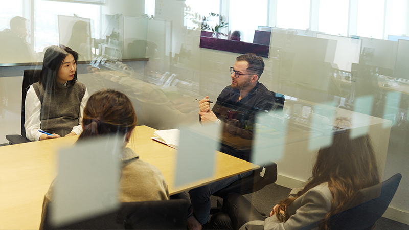 Jakub in a conference room